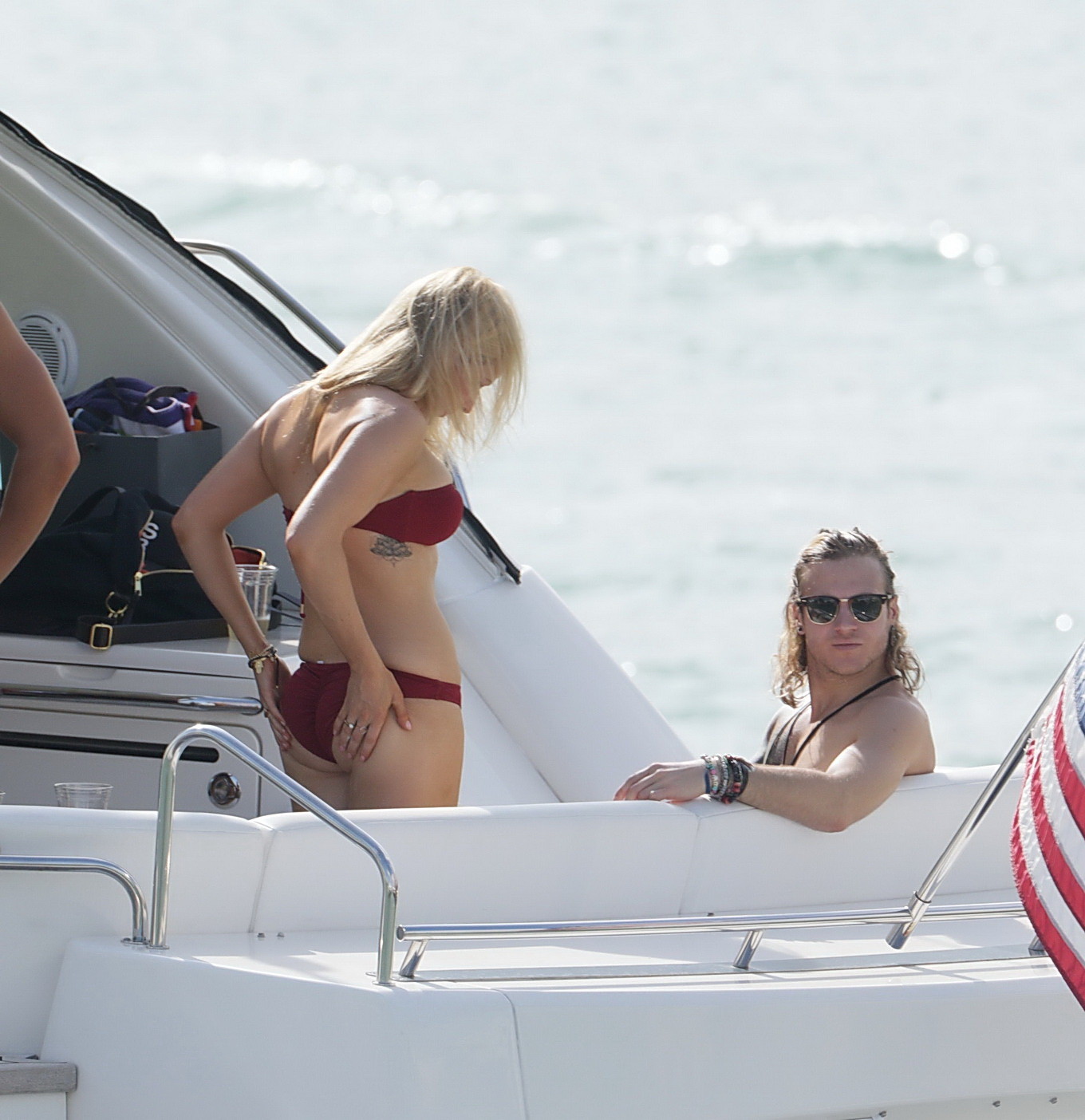 Ellie Goulding showing her ass in skimpy cherry colored bikini at the boat in Mi #75177132
