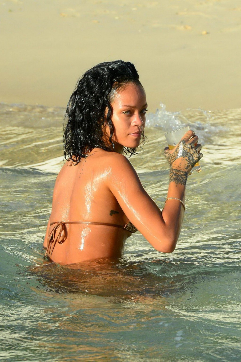 Rihanna showing off her perfect body in a wet string bikini at the beach in Barb #75209211
