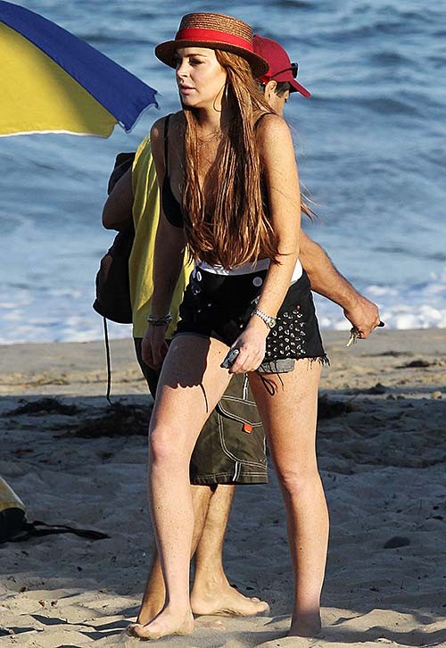 Lindsay Lohan exposing huge boobs in bikini top on beach #75254803