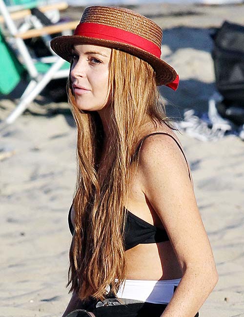 Lindsay Lohan exposing huge boobs in bikini top on beach #75254811