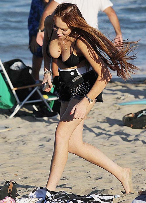 Lindsay Lohan exposing huge boobs in bikini top on beach #75254827
