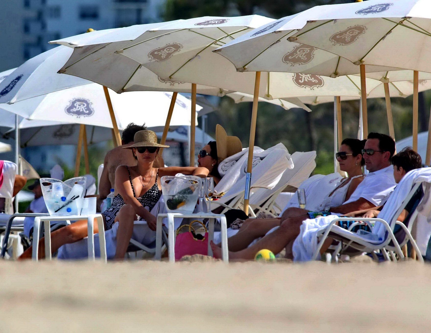 Daisy Fuentes showing ass and sideboob wearing a monochrome bikini on a beach in #75196508