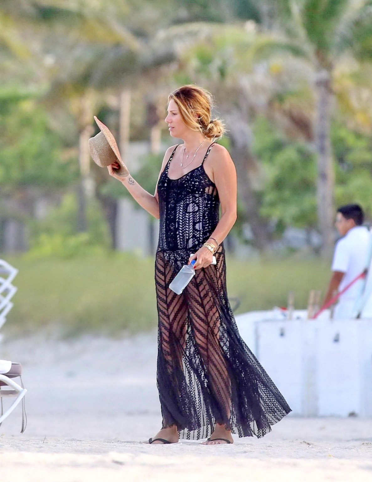 Daisy Fuentes showing ass and sideboob wearing a monochrome bikini on a beach in #75196528