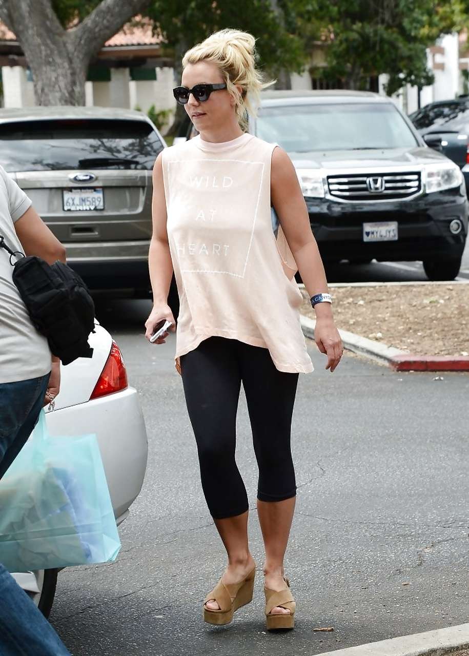 Britney Spears showing boobs in see thru shirt on street #75226230