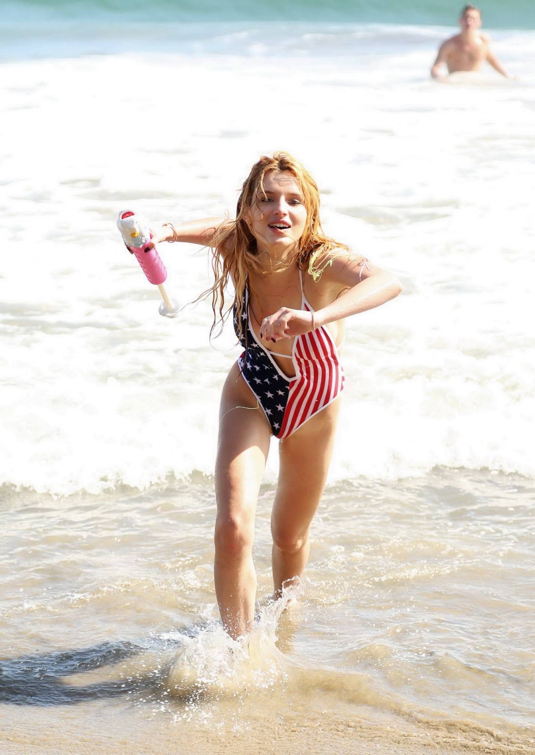 Bella Thorne in low cut national colored swimsuit #75159330