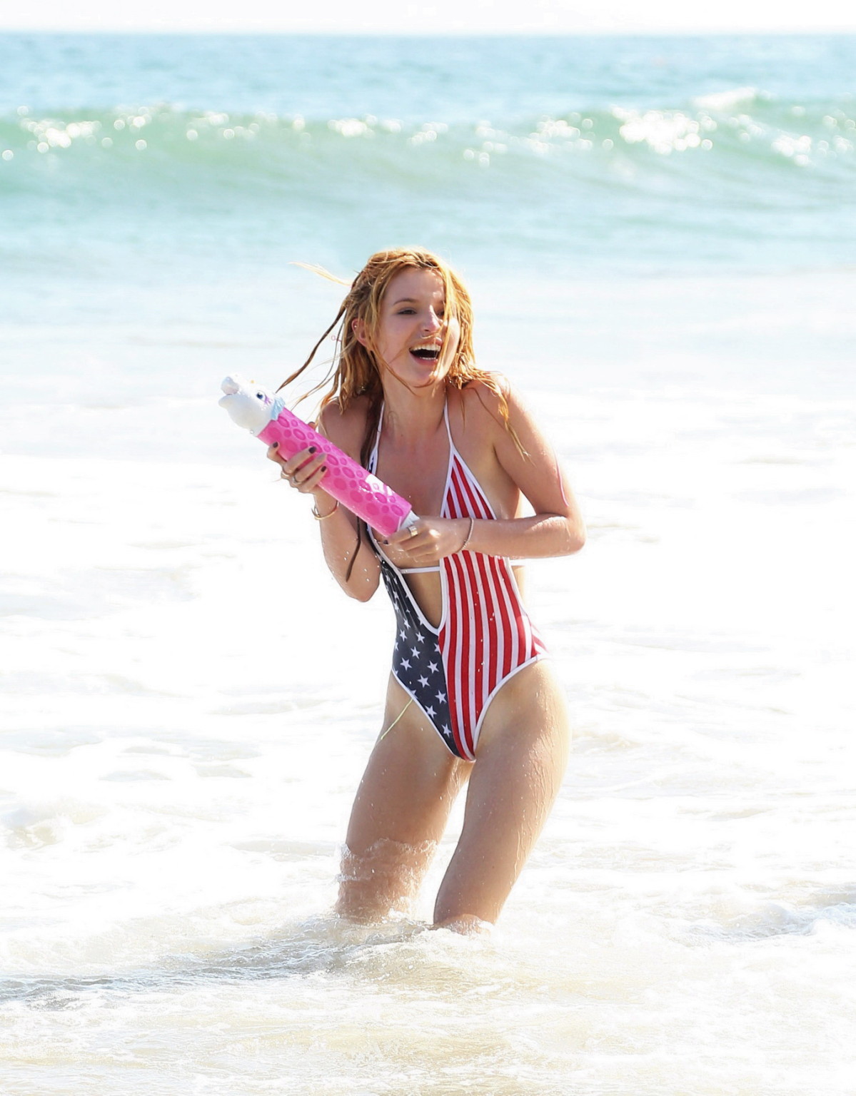 Bella Thorne in low cut national colored swimsuit #75159334