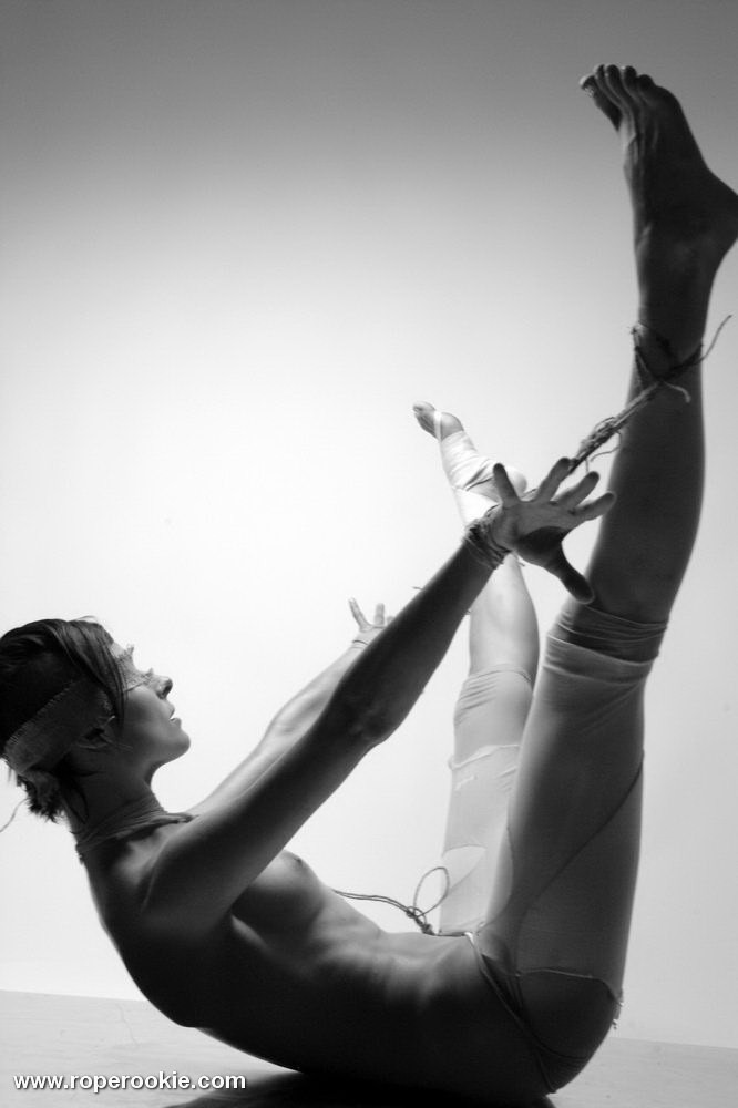 Skinny model tied and roped up in a cold room. #71998790