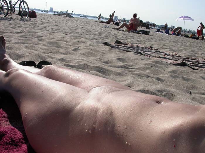 Blonde has some fun being nude on a public beach #72255528