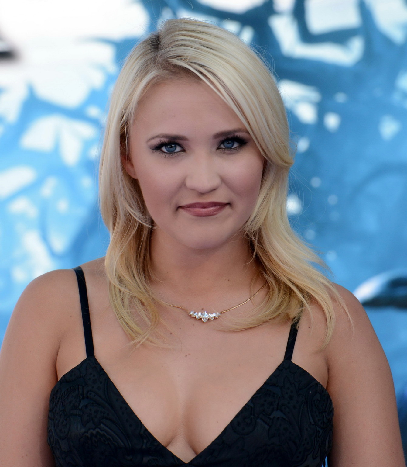Busty Emily Osment wearing a low cut black dress at the Maleficent premiere in H #75195331