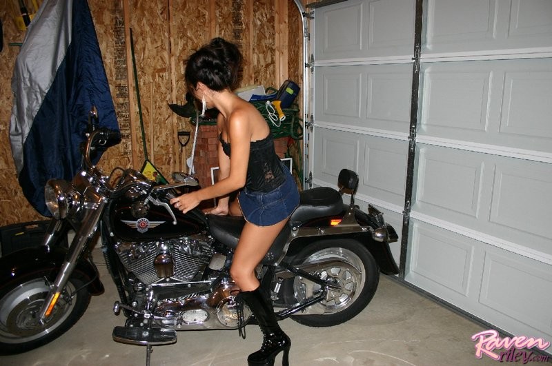 Sexy Raven looking hot next to a motorcycle #67146334