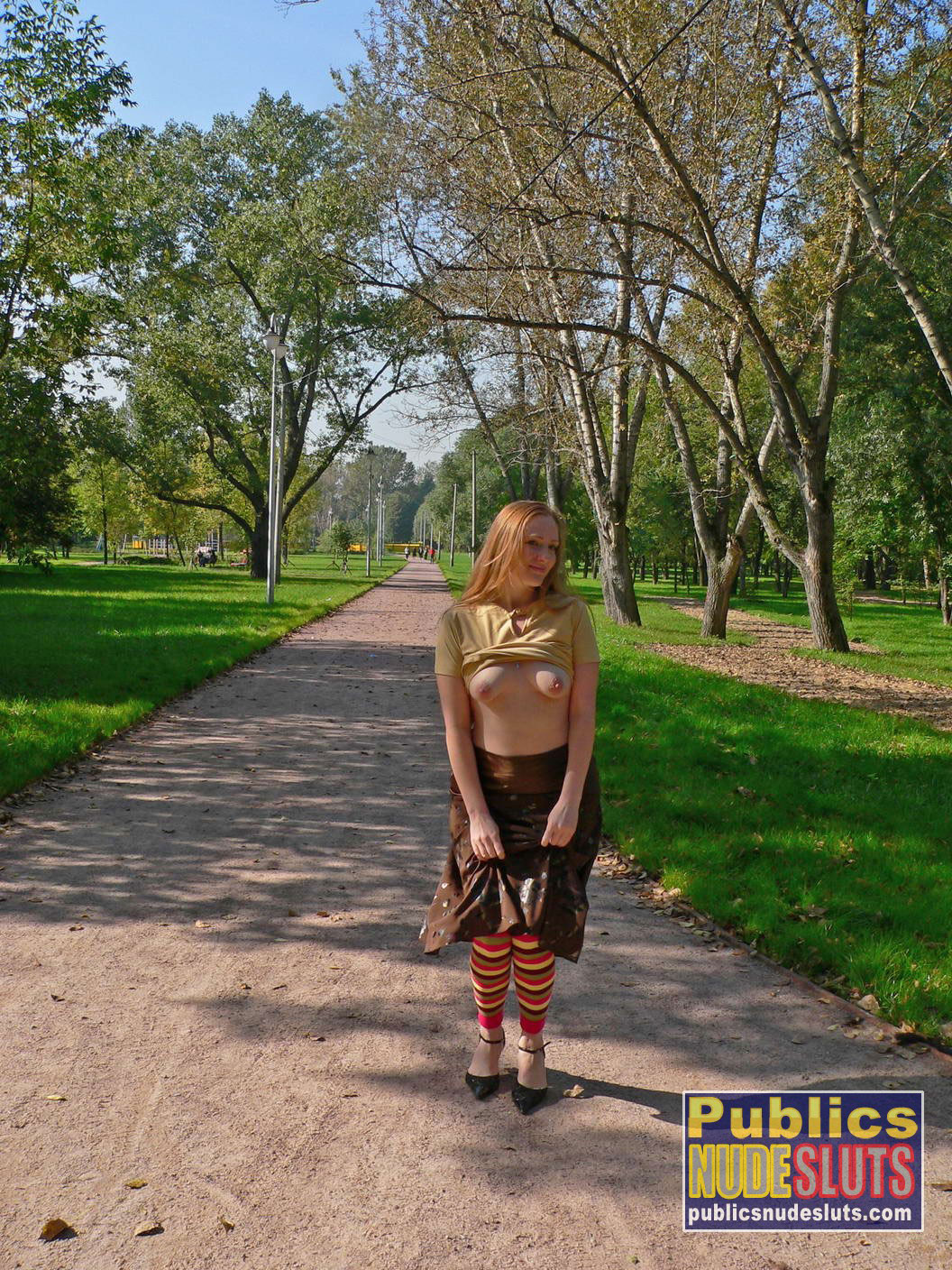 Very sexy redhead flashing in the park #67315560