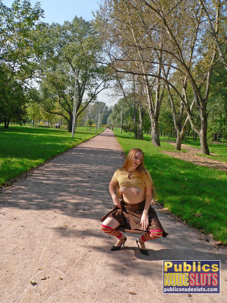 Very sexy redhead flashing in the park #67315572