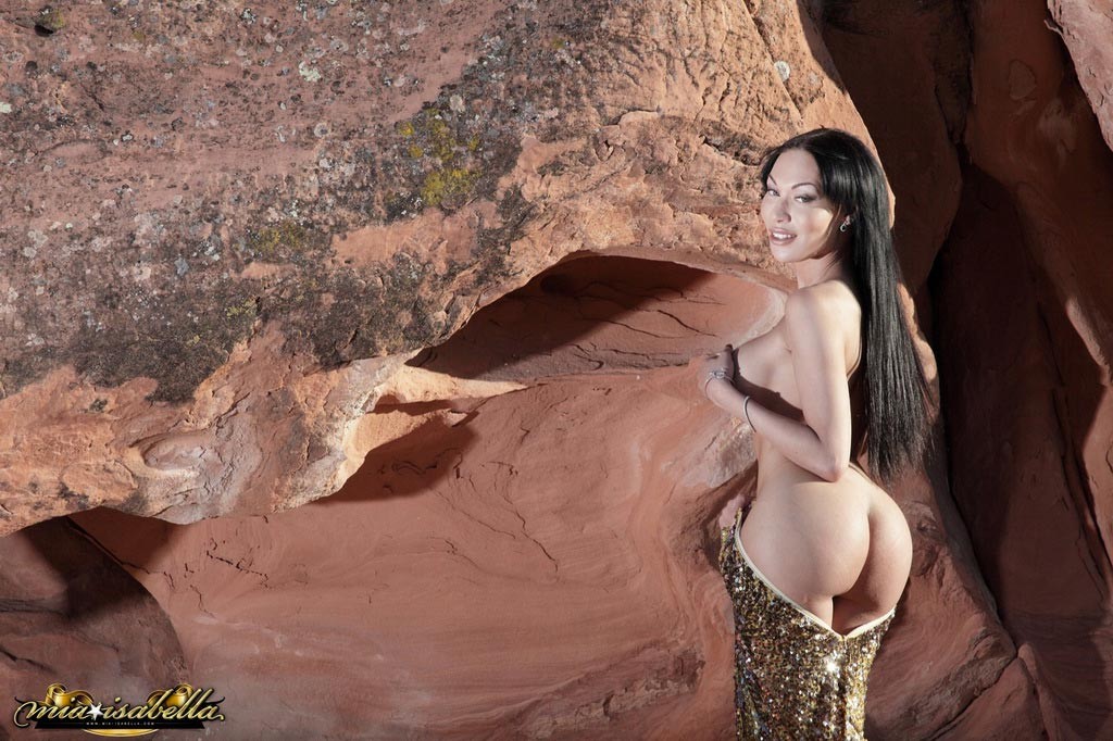 Transsexual beauty Mia Isabella strips in the cave #79201841