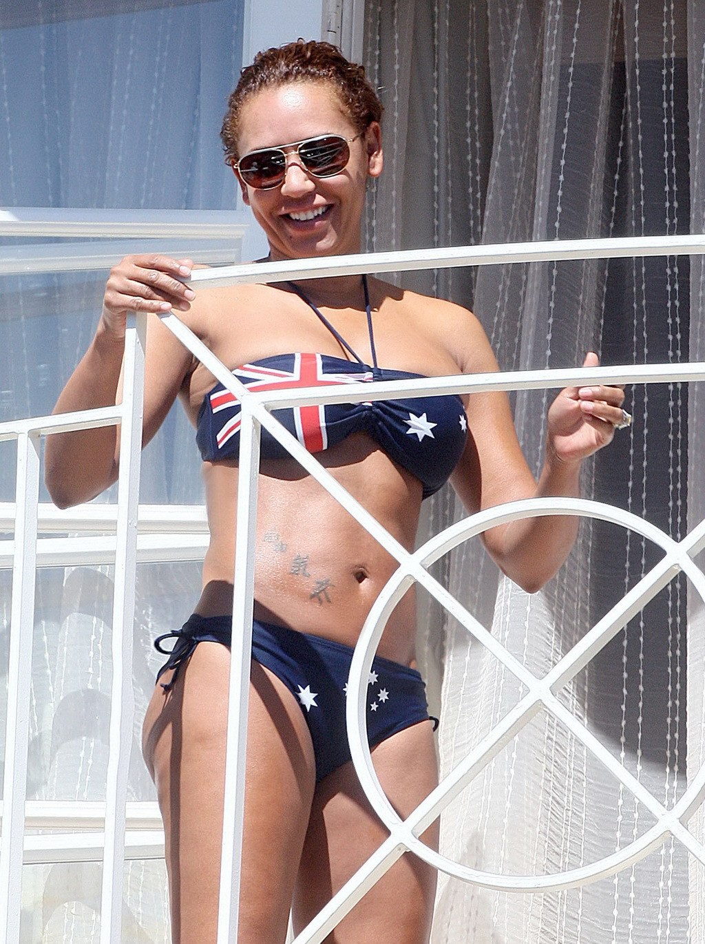 Melanie Brown in bikini caught by paparazzi while tanning on balcony in LA #75258287