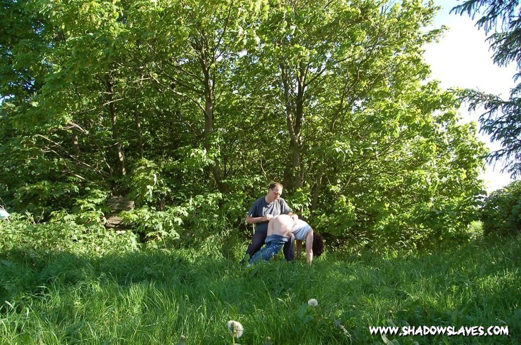 Slave girl outdoors stung by stinging nettles #72212022