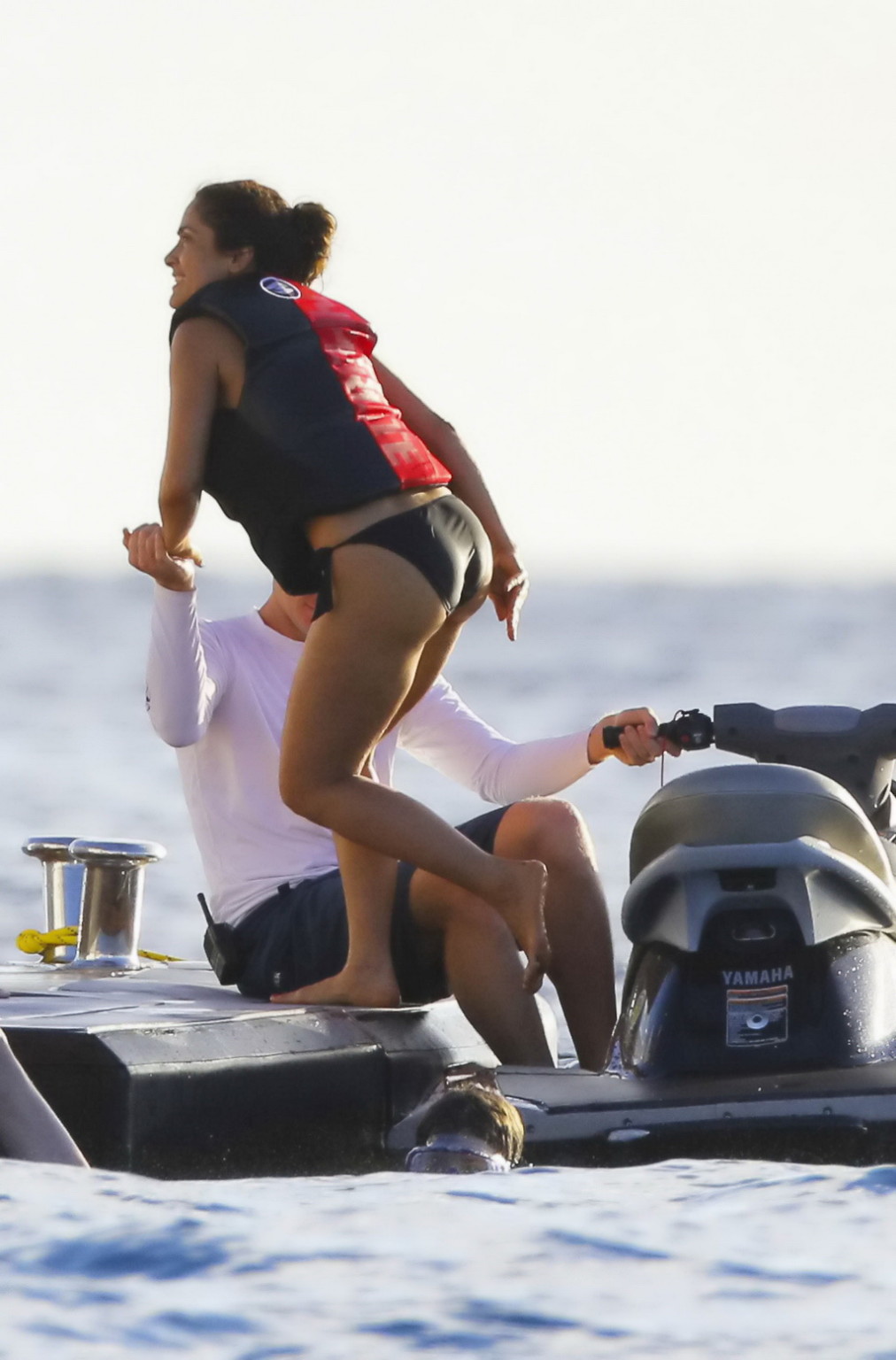 Salma Hayek shows off her big boobs and ass in tiny black bikini at a yacht in S #75176983