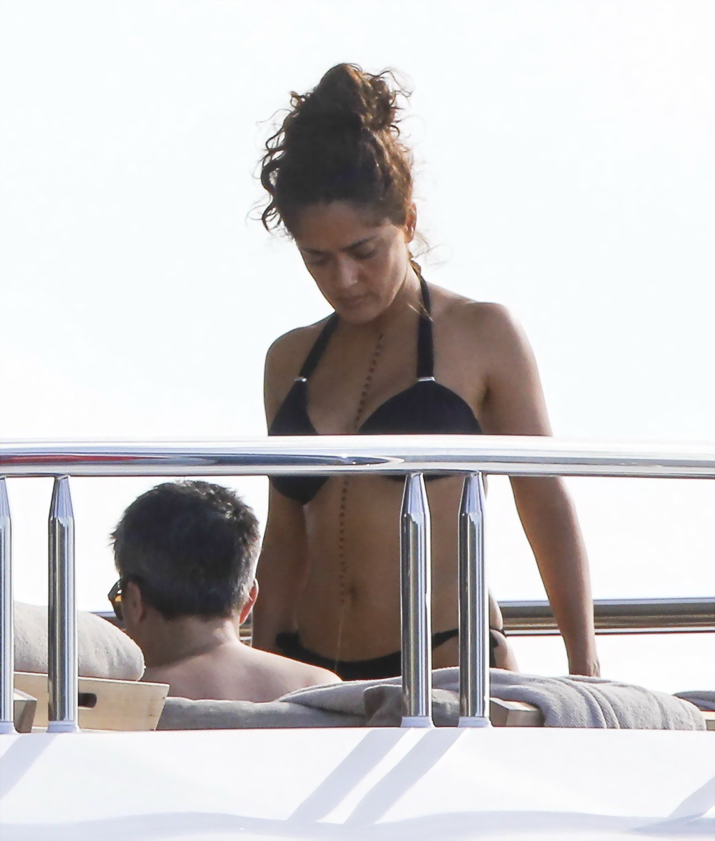 Salma Hayek shows off her big boobs and ass in tiny black bikini at a yacht in S #75177028