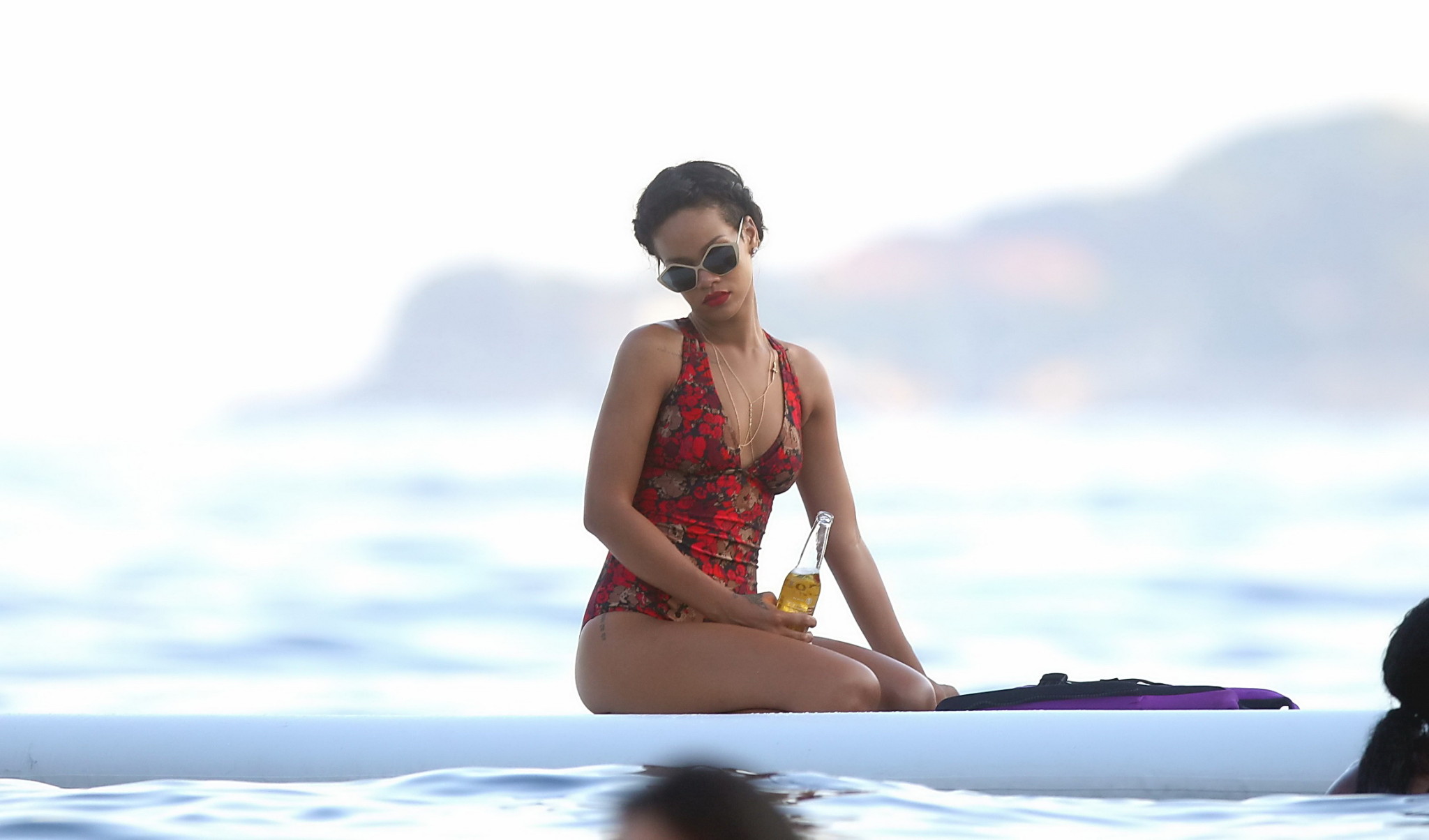 Rihanna tanning her hot body in a flower print bikini at the pool in Hawaii #75240371