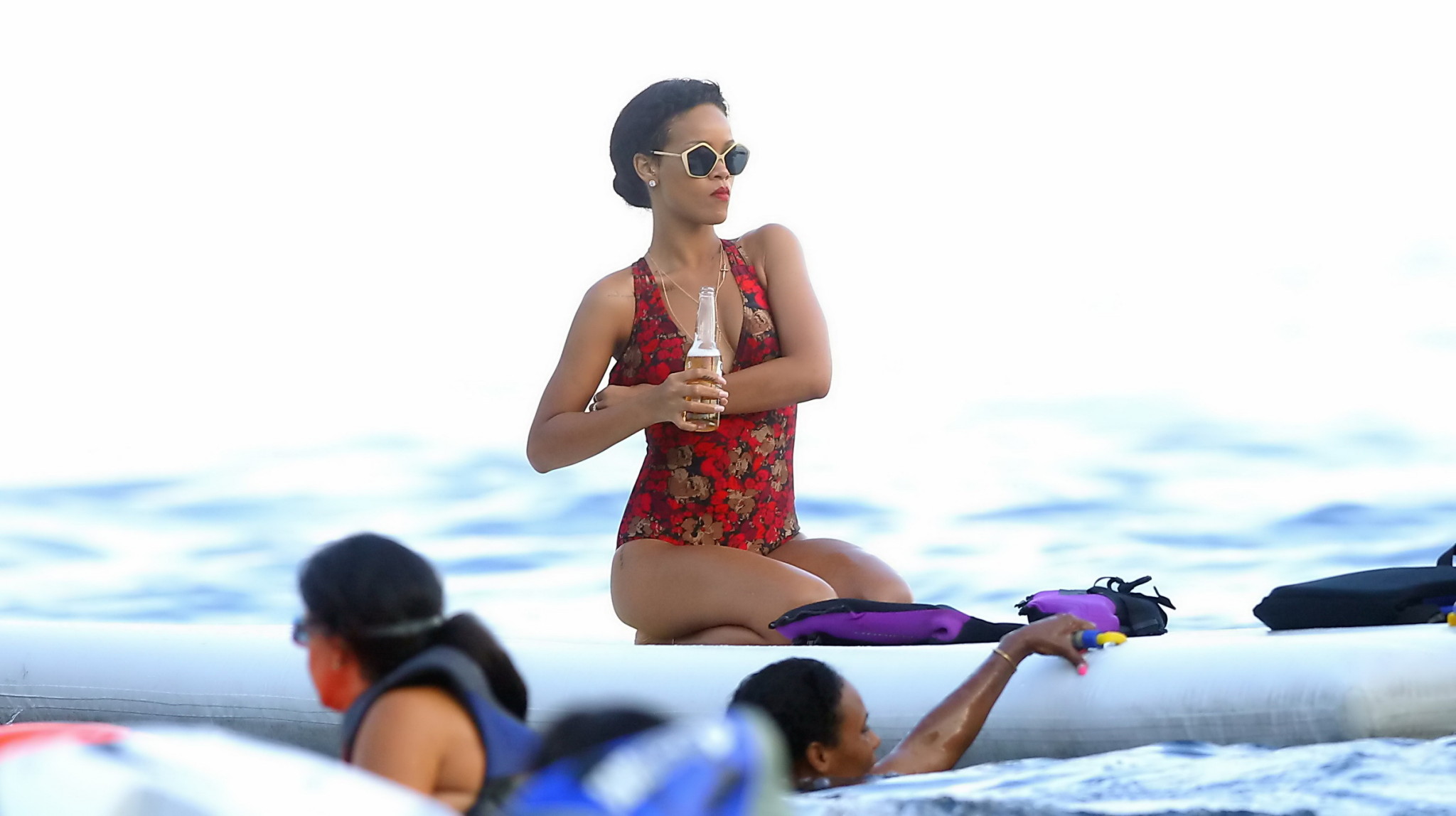 Rihanna tanning her hot body in a flower print bikini at the pool in Hawaii #75240380