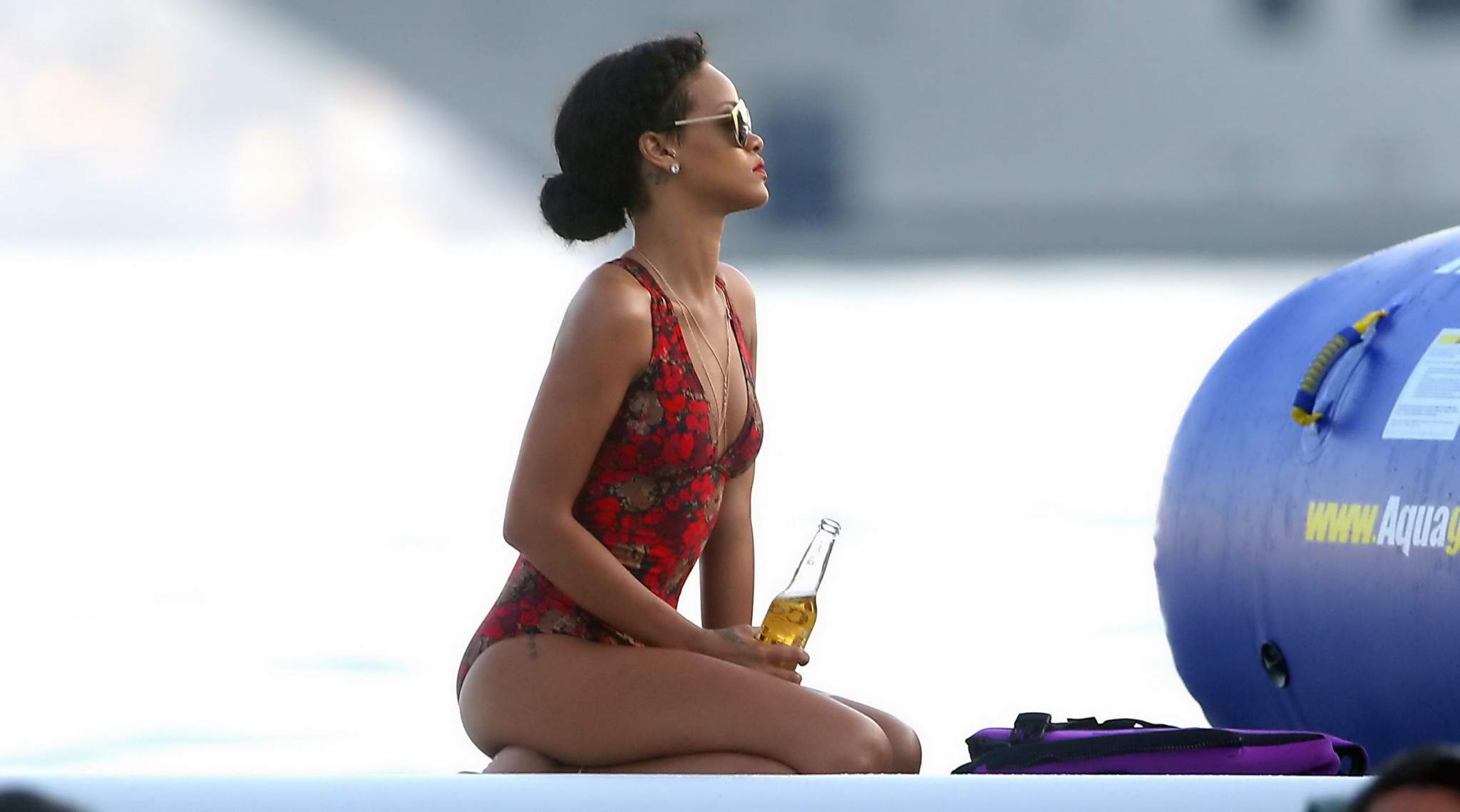 Rihanna tanning her hot body in a flower print bikini at the pool in Hawaii #75240393