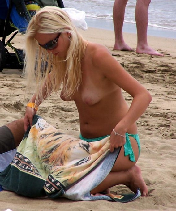 Watch a naked chick at the beach tan her hot body #72249321