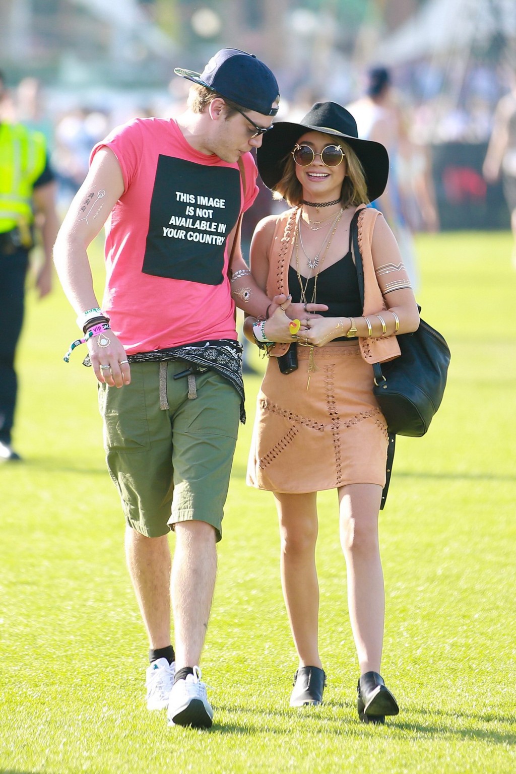 Sarah Hyland cleavy and leggy in black top and leather mini skirt at Coachella V #75167306