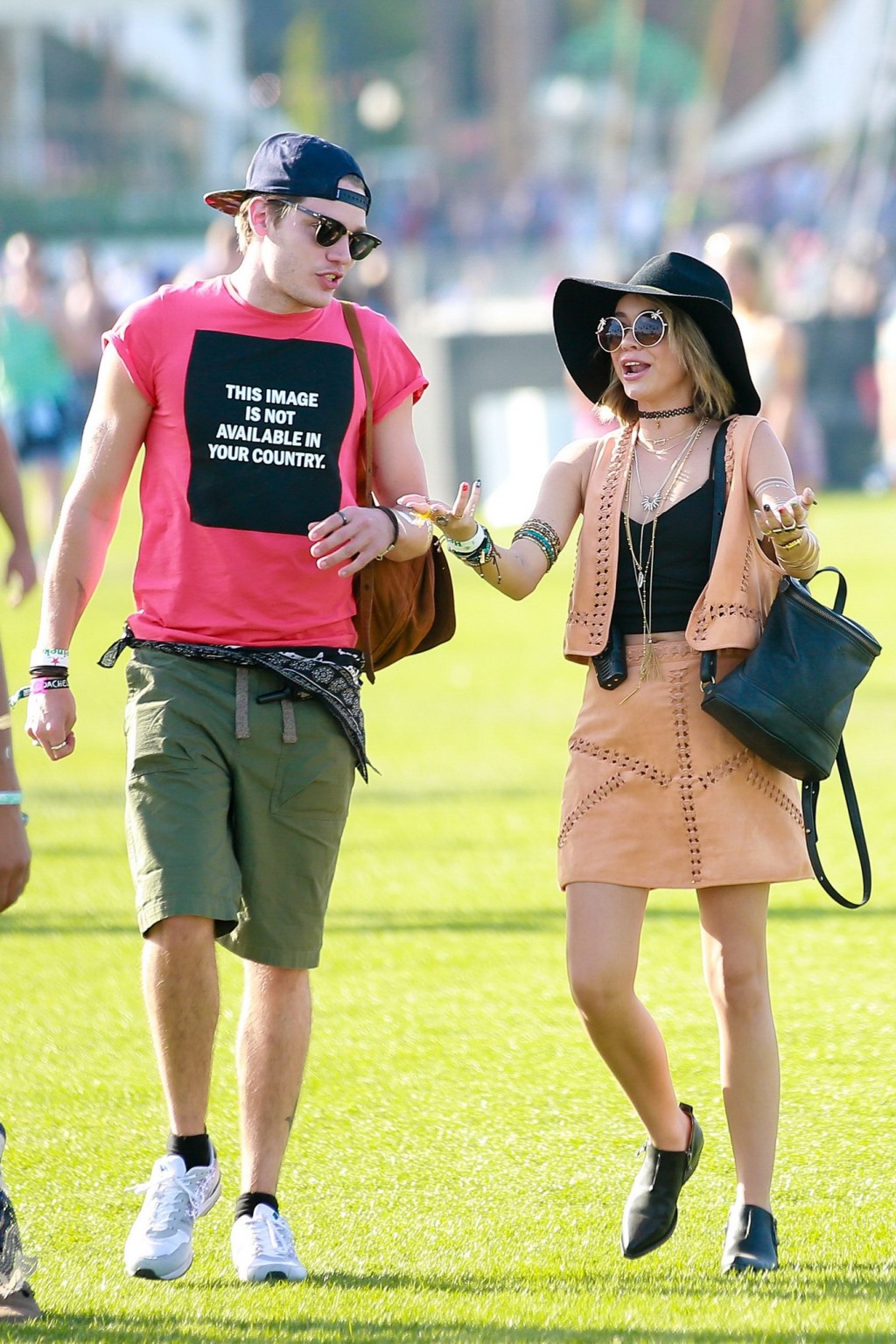 Sarah Hyland cleavy and leggy in black top and leather mini skirt at Coachella V #75167331