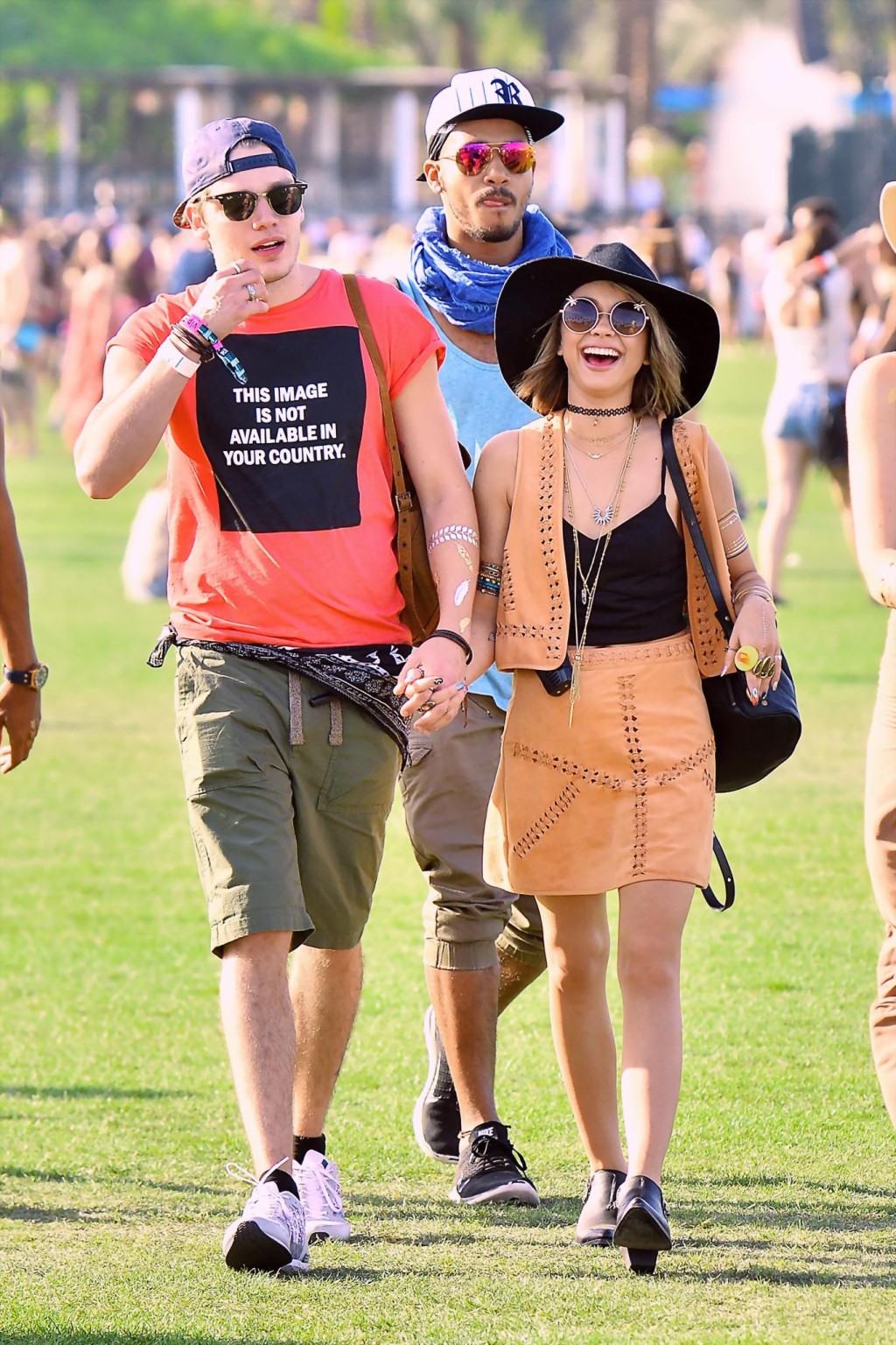 Sarah Hyland cleavy and leggy in black top and leather mini skirt at Coachella V #75167590