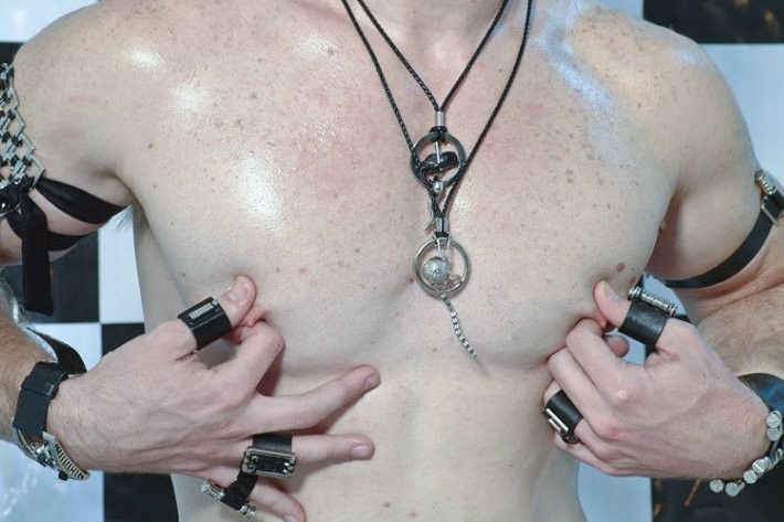 Leather lad in jockstraps plays the fool in studio #76931709