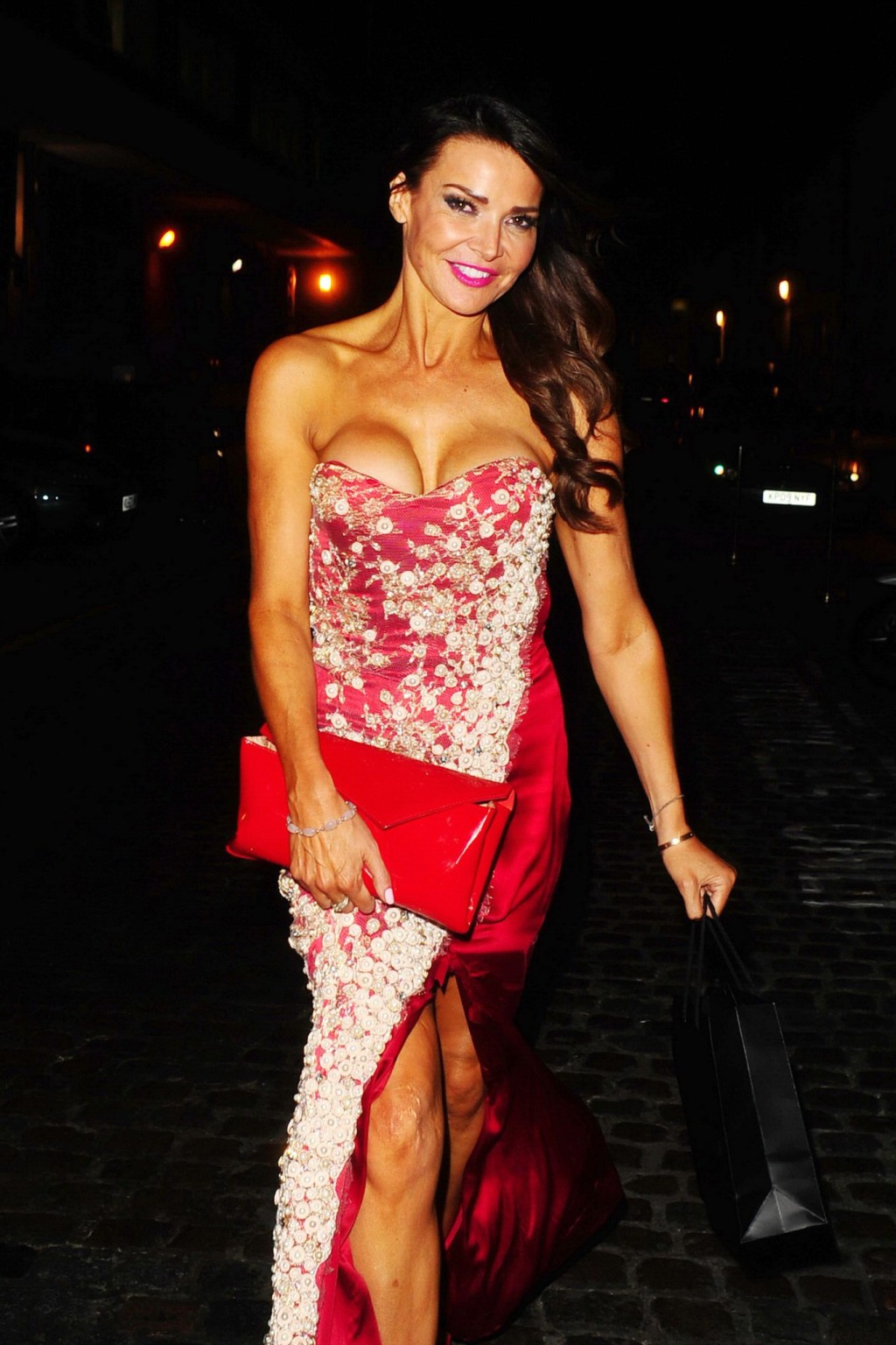 Lizzie Cundy shows huge cleavage wearing a strapless dress outside The Chiltern  #75185568