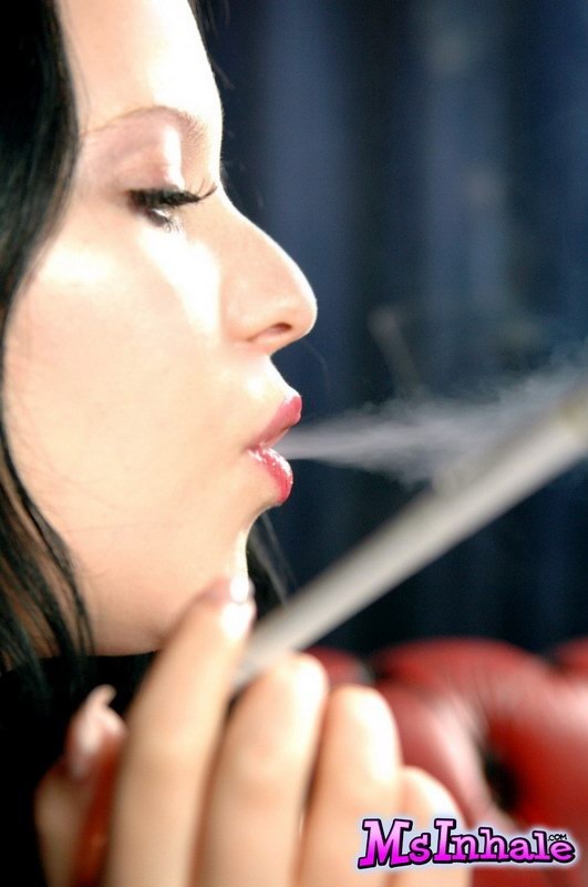 brunette teen smoking a cigarette #74982725