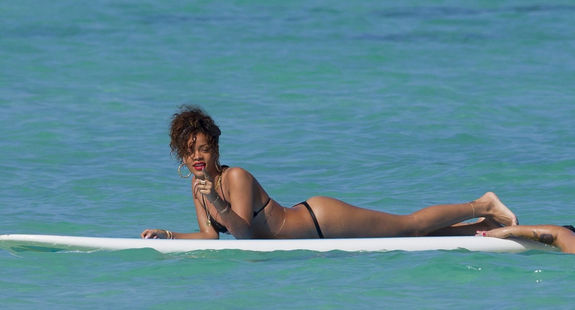 Rihanna shows off her ass wearing black thong bikini on a beach in Hawaii #75275682