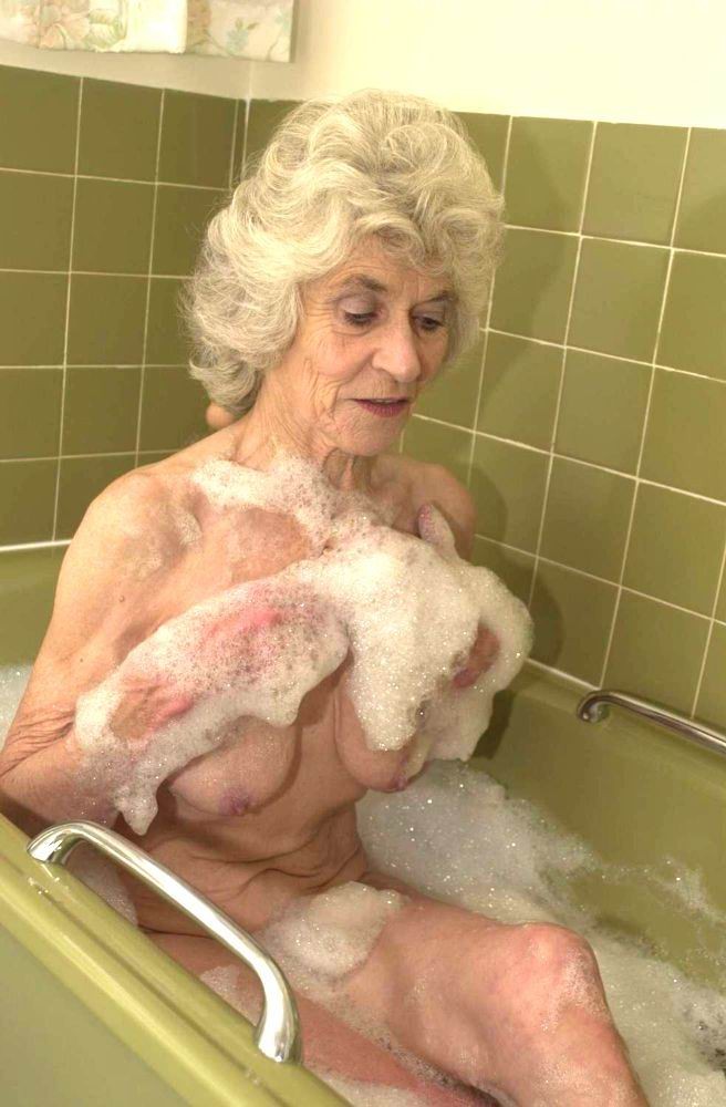 very old granny taking a bath #67374474