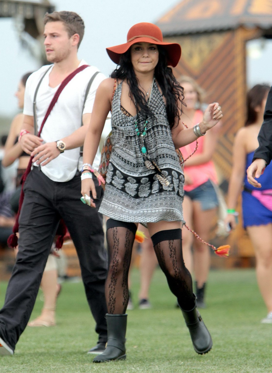 Vanessa Hudgens upskirt wearing a mini skirt  stockings at Coachella Music Festi #75266459