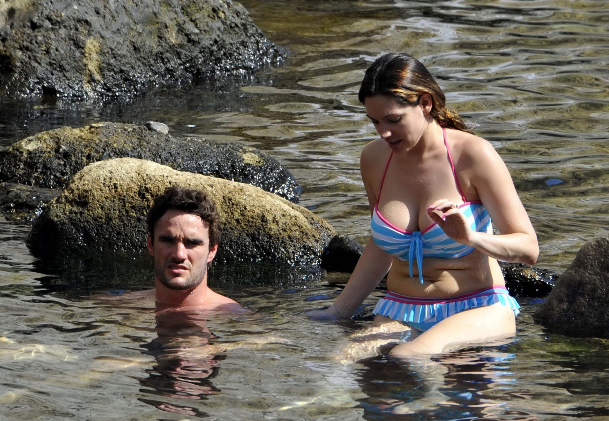 Kelly Brook busty wearing blue-white stripe bikini on a beach in Ischia, Italy #75257564