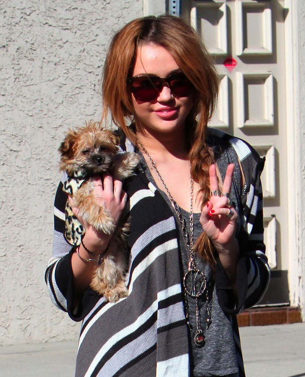 Miley Cyrus posing sexy with her puppy for paparazzi and kissing with girl in pe #75318248