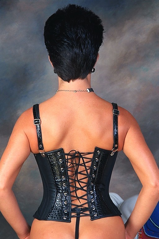 sexy brunette model in corsets posing #72225064