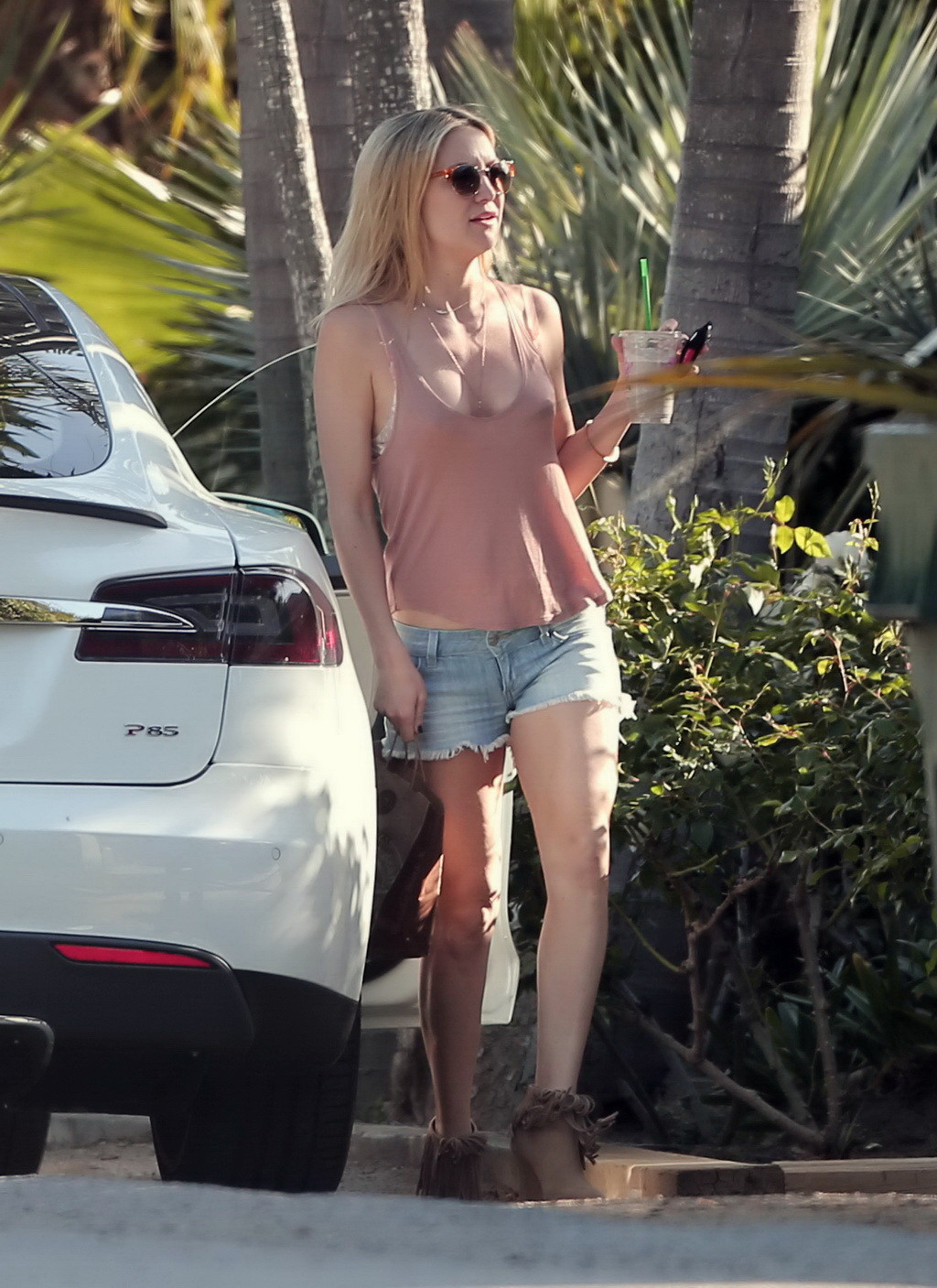 Kate Hudson bra peek and leggy in tiny tank top and denim shorts while out for a #75170709