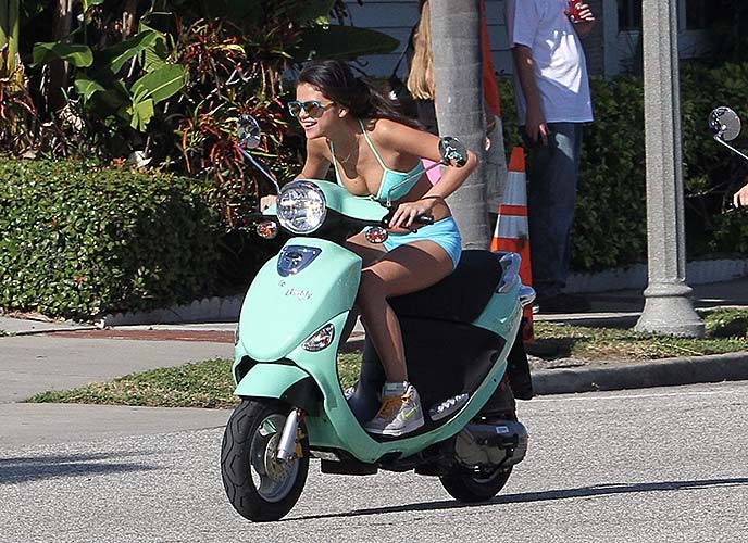 Selena Gomez driving a bike and showing tiny tits in bikini top #75270635