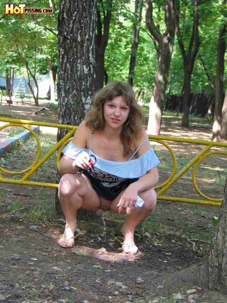 Slut pissing in the park #76567397