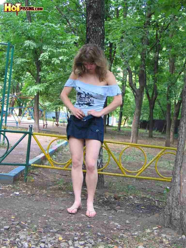 Slut pissing in the park #76567470