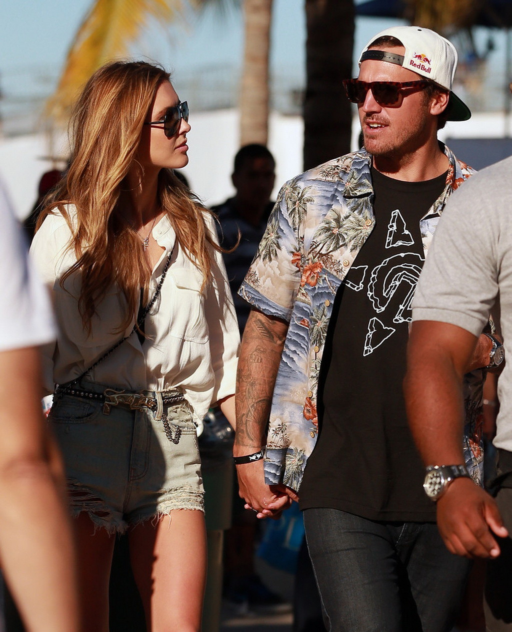 Audrina Patridge wearing ripped denim shorts and wide open shirt at RedBull Flug #75249261