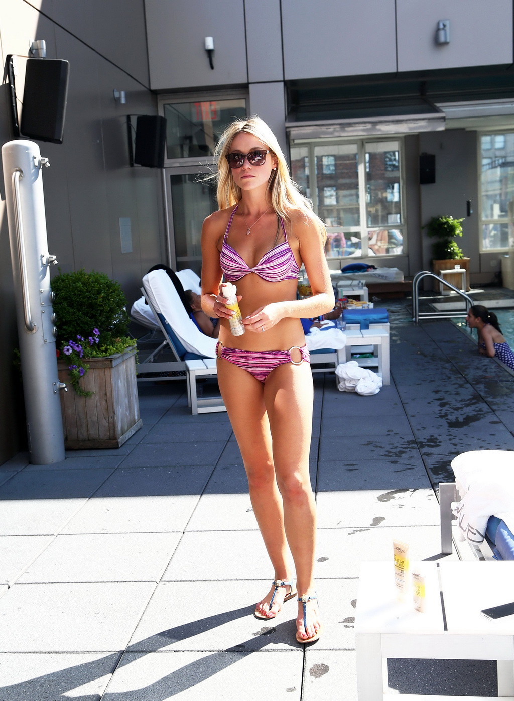 Katrina Bowden shows off her hot bikini body poolside while covers up with L'Ore #75254964