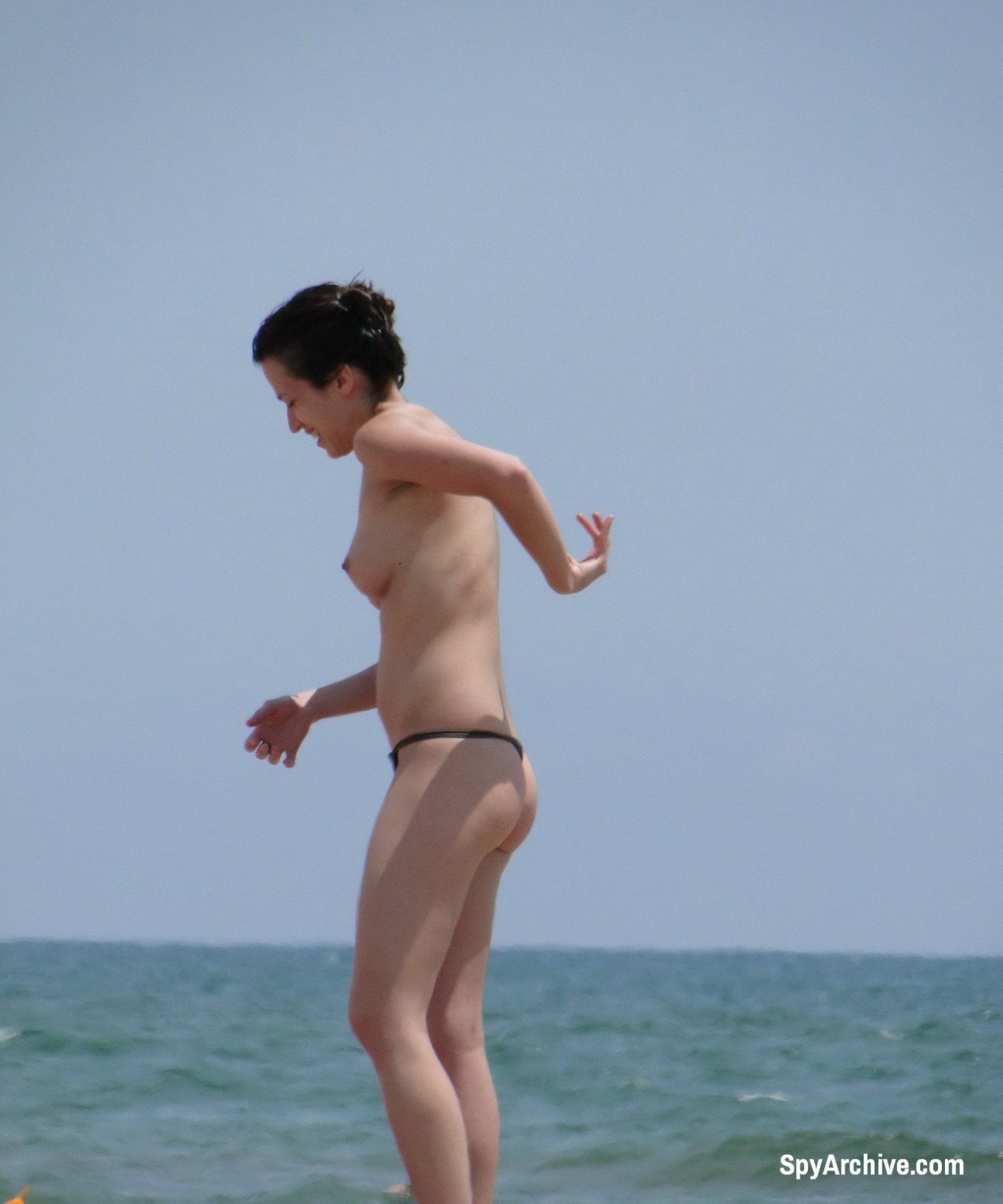 Sexy topless brunette gets filmed by beach voyeur #72242050