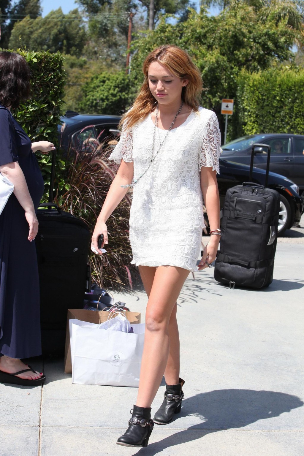 Miley Cyrus leggy wearing white mini dress at the house party #75289831