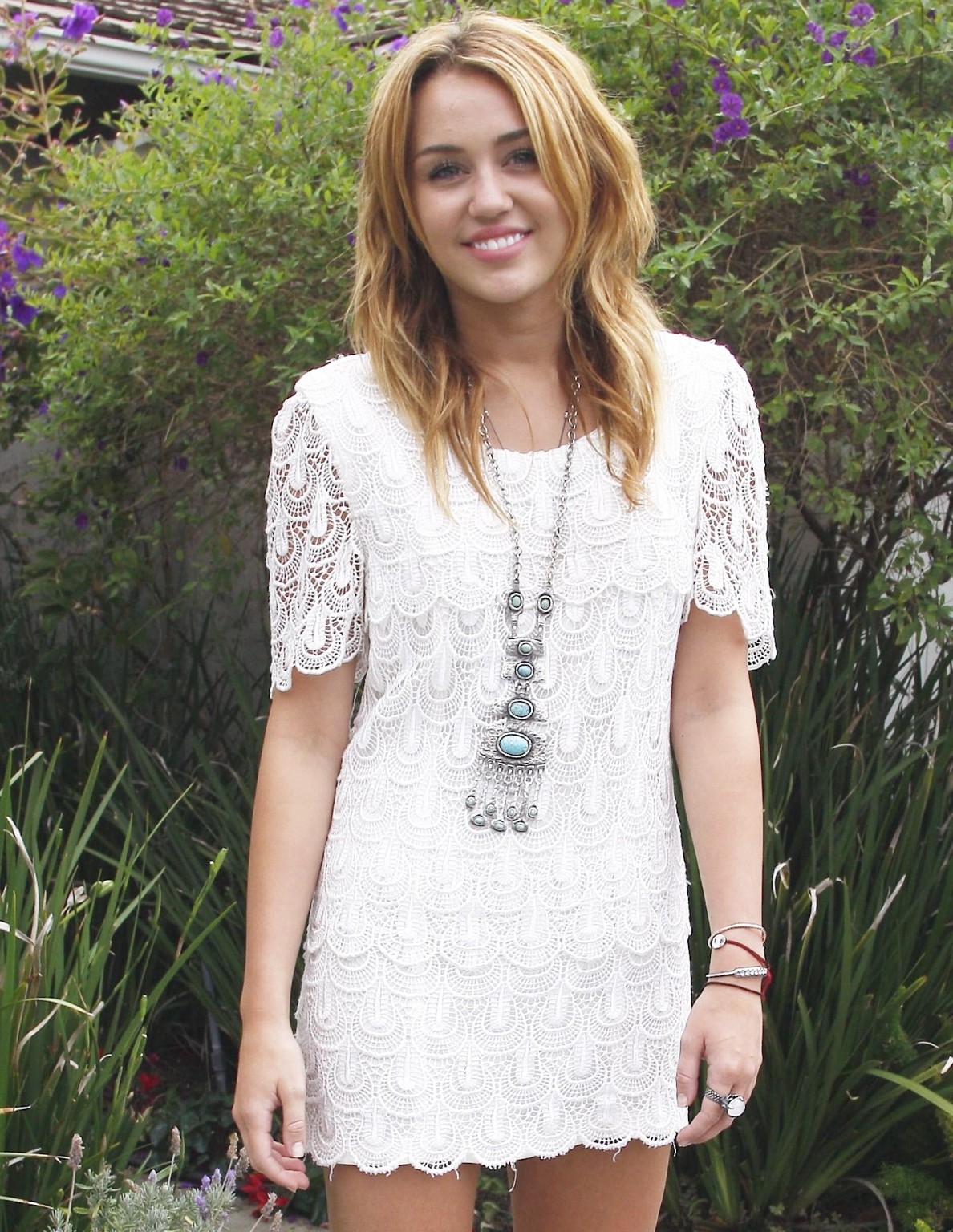 Miley Cyrus leggy wearing white mini dress at the house party #75289917