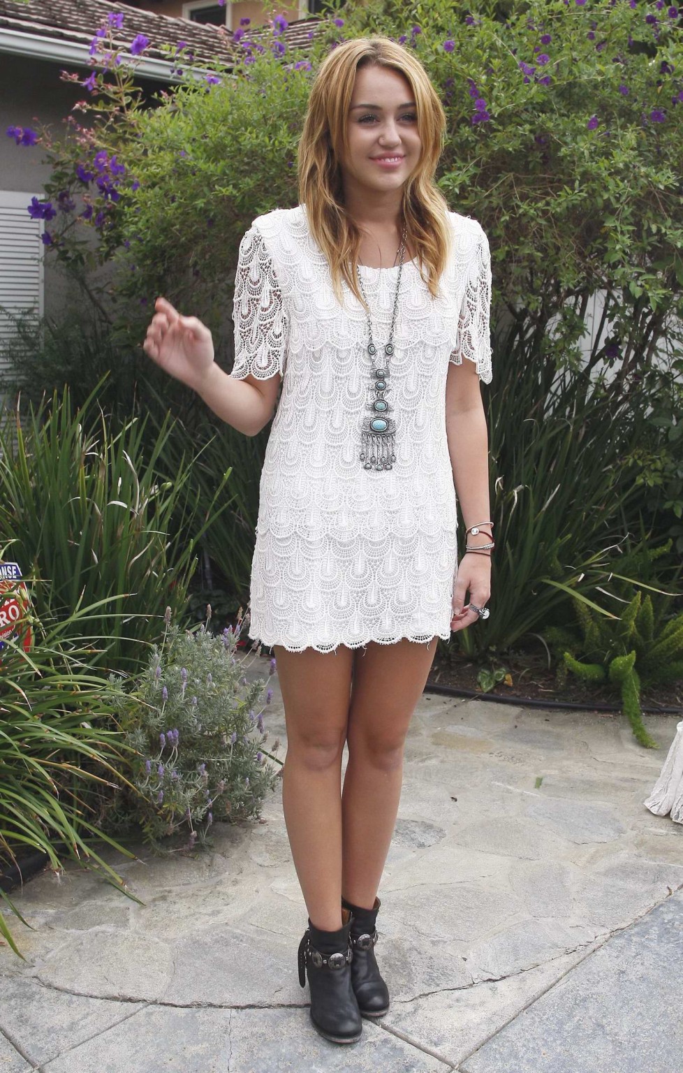 Miley Cyrus leggy wearing white mini dress at the house party #75289927