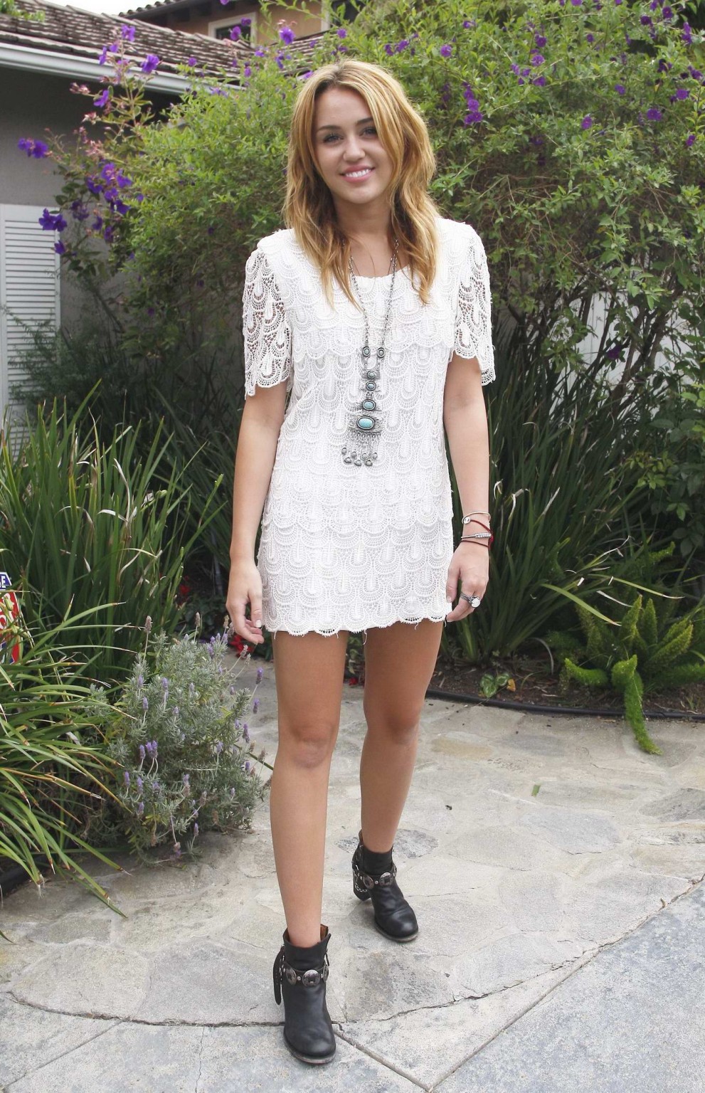 Miley Cyrus leggy wearing white mini dress at the house party #75289935