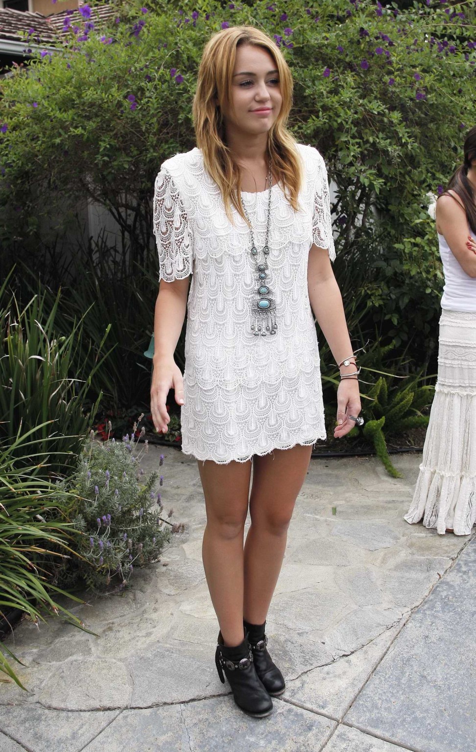 Miley Cyrus leggy wearing white mini dress at the house party #75289962