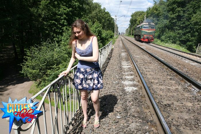 Cute exhibitionist showing pink at a train station #71609686